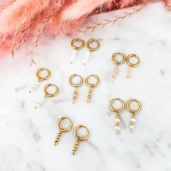 Finaste Goud kleurige oorbellen met roze steentjes Sale