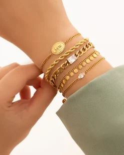 Finaste Schakelarmband gedraaid goudkleurig Best