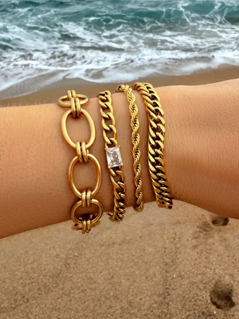 Finaste Schakelarmband gedraaid goudkleurig Best
