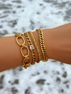 Finaste Schakelarmband gedraaid goudkleurig Best