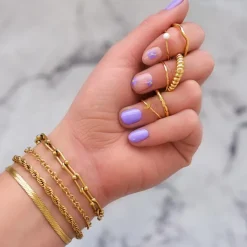 Finaste Schakelarmband gedraaid goudkleurig Best