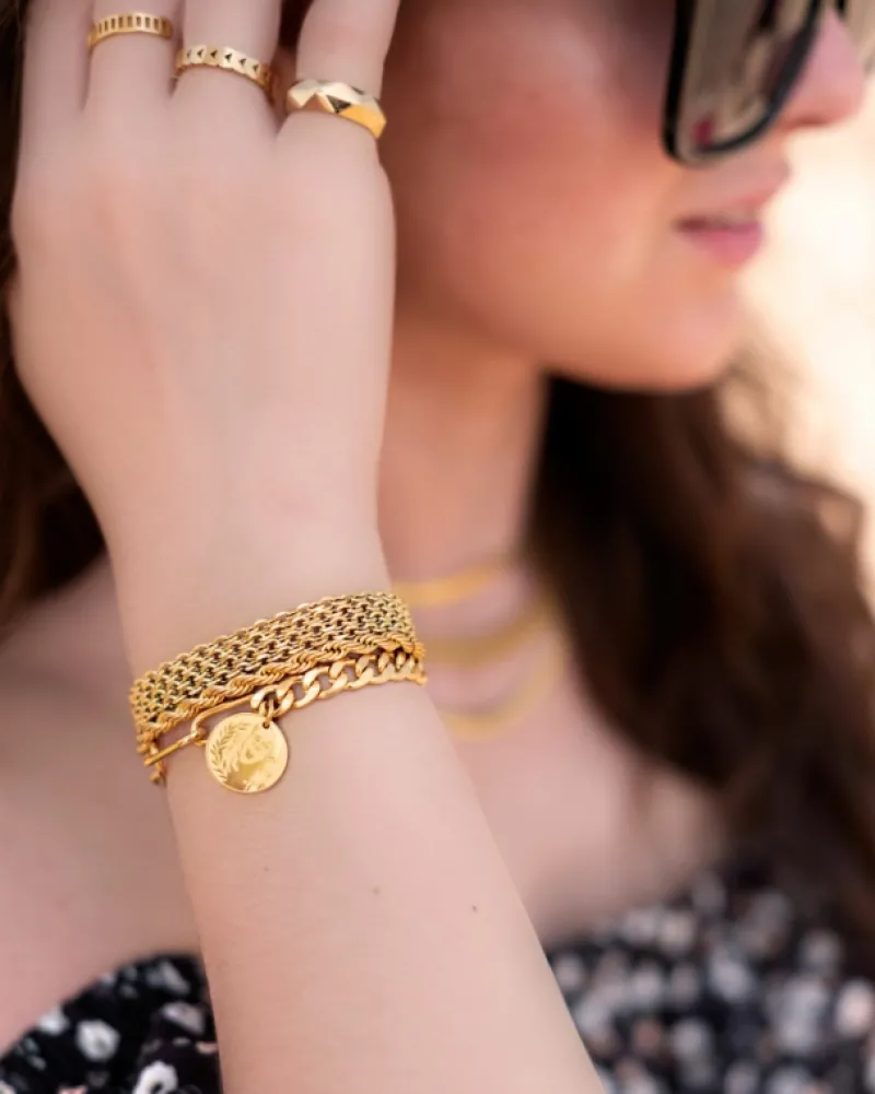 Finaste Schakelarmband gedraaid goudkleurig Best