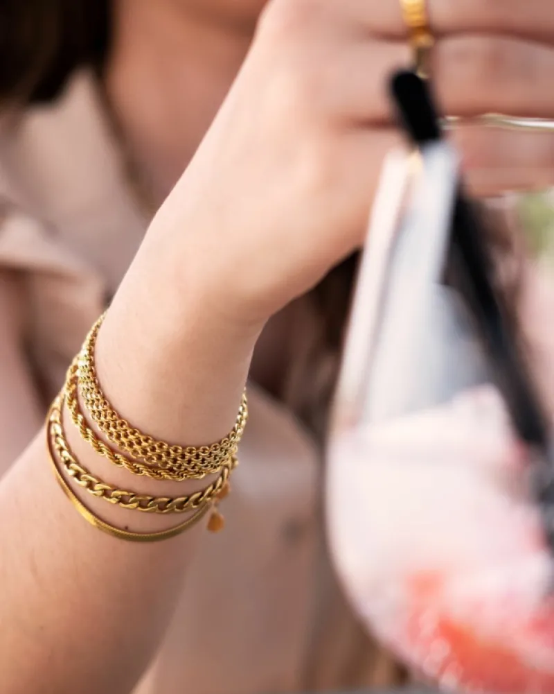 Finaste Schakelarmband gedraaid goudkleurig Best