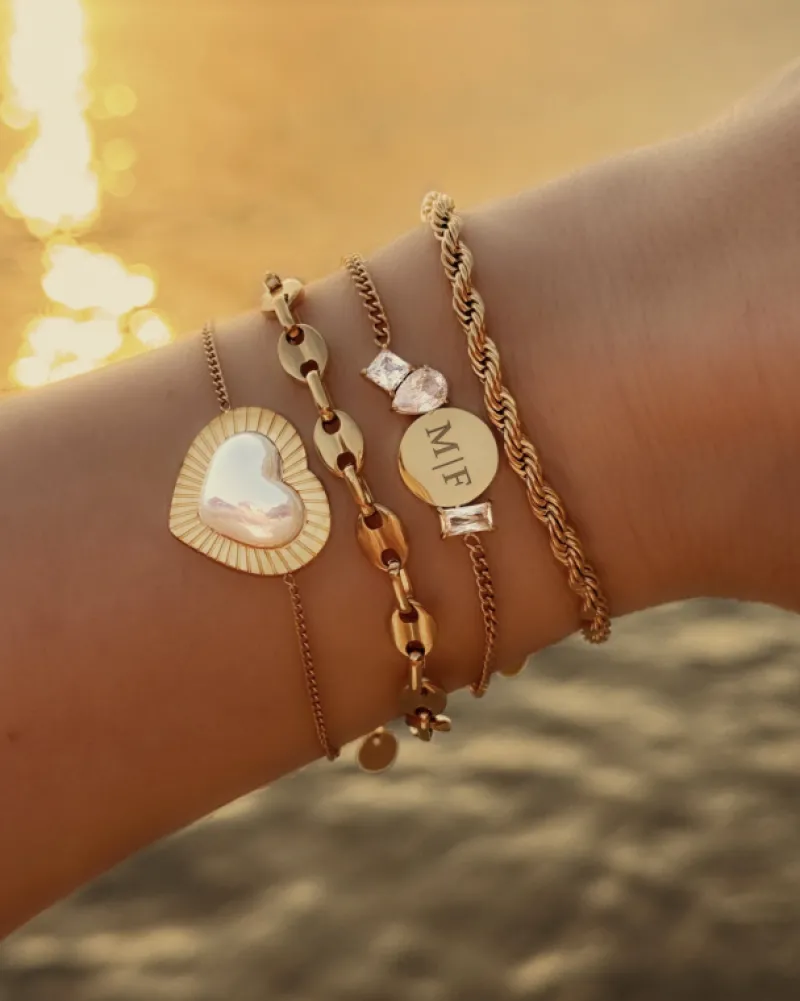 Finaste Schakelarmband gedraaid goudkleurig Best