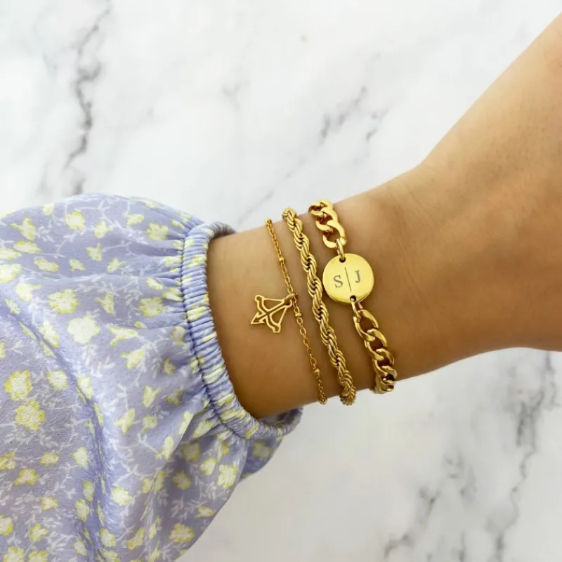 Finaste Schakelarmband gedraaid goudkleurig Best