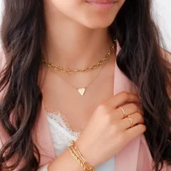 Finaste Schakelarmband gedraaid goudkleurig Best